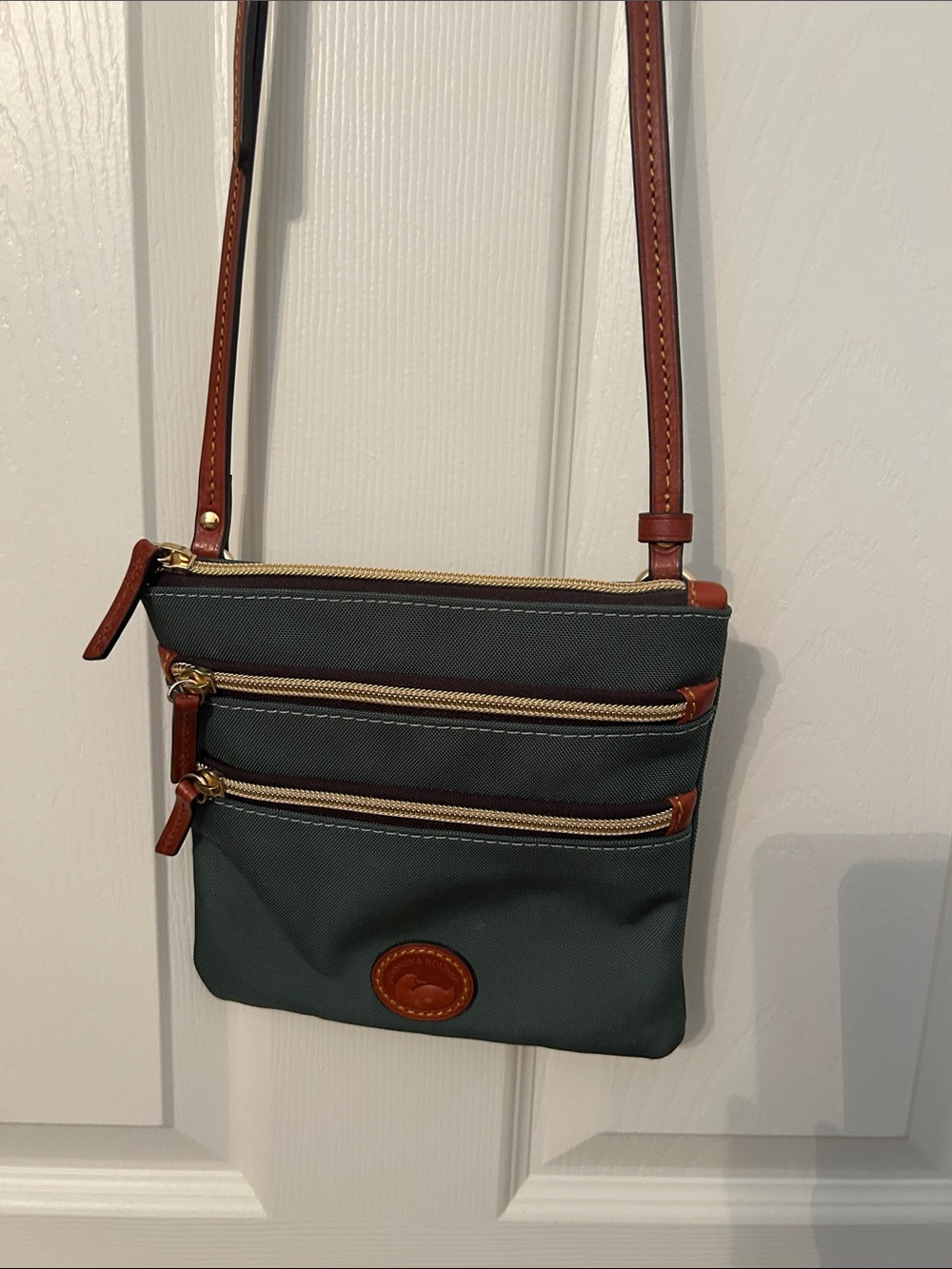 Dooney and Bourke Crossbody Triple-Zip Bag in Dark Green with Brown Trim